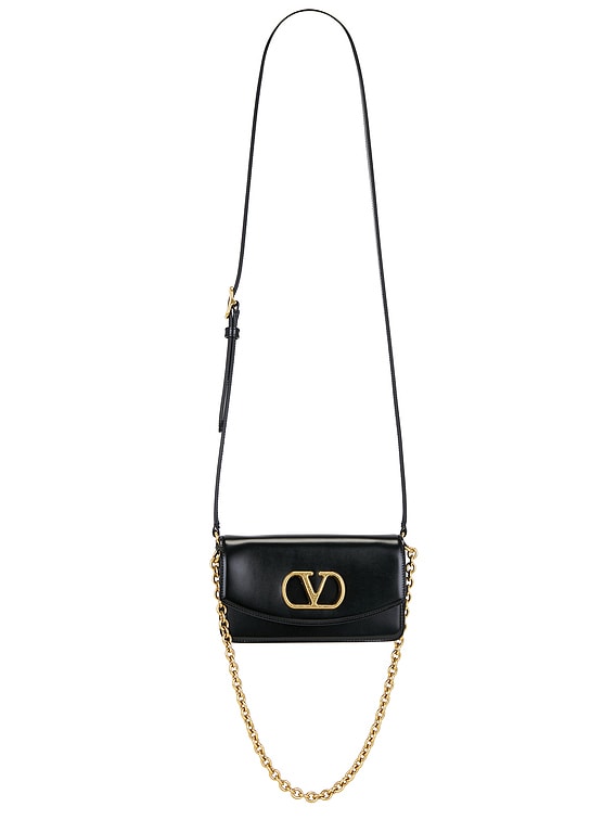 Valentino Garavani Vain Small Clutch in Nero | FWRD
