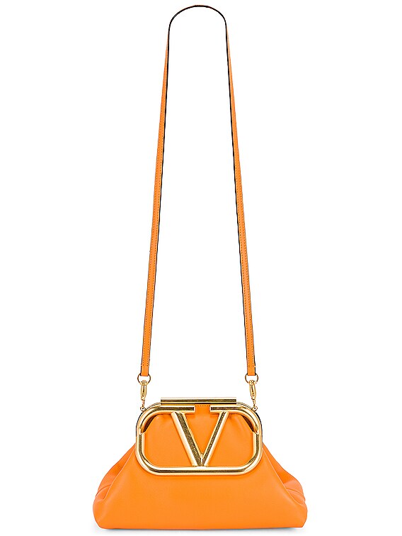 Valentino Garavani Medium Clutch in Pale Apricot | FWRD