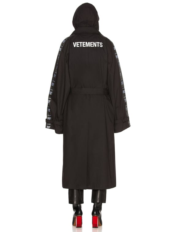VETEMENTS Plastic Bag Trench Coat in Black | FWRD