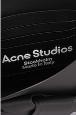 Acne Studios Musubi Wallet Crossbody Bag in Black, view 7, click to view large image.