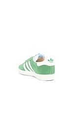 adidas Originals Gazelle Sneaker in Preloved Green, White, & Core White, view 3, click to view large image.