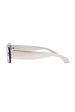 ALAÏA Lettering Logo Rectangular Sunglasses in Silver, view 3, click to view large image.