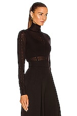 ALAÏA Long Sleeve Roll Neck Sweater in Noir, view 2, click to view large image.