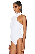 ALAÏA Cut Out Long Sleeve Bodysuit in Blanc, view 4, click to view large image.
