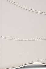 ALAÏA Djinn Zipped Hobo Bag in Ivorie, view 6, click to view large image.