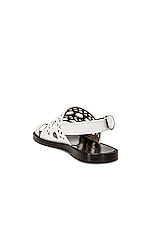 ALAÏA Perforated Flat Sandal in Blanc Casse, view 3, click to view large image.