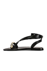 ALAÏA Flat Ankle Strap Sandals in Noir, view 5, click to view large image.