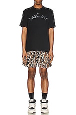 Amiri Stacked Print Swim Trunks in Black, view 4, click to view large image.