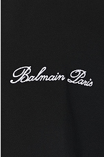 BALMAIN Signature Embroidered Zipped Polo in Black, view 3, click to view large image.