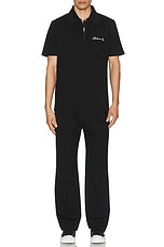 BALMAIN Signature Embroidered Zipped Polo in Black, view 5, click to view large image.