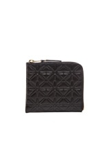 COMME des GARCONS Small Star Embossed Zip Wallet in Black, view 1, click to view large image.