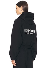 Fear of God ESSENTIALS Cropped Hoodie in Black | FWRD