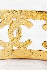 FWRD Renew Chanel Coco Mark Bangle Bracelet in Gold, view 3, click to view large image.