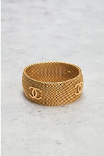 FWRD Renew Chanel Coco Mark Bangle Bracelet in Gold, view 2, click to view large image.