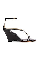 KHAITE Marion Ankle Strap Wedge Sandal in Black, view 1, click to view large image.