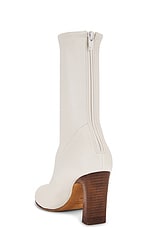 KHAITE Apollo 85 Mid Heel Boot in Cream, view 3, click to view large image.