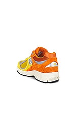 New Balance 2002R in Ginger Lemon, Classic Orange, & Shadow Grey, view 3, click to view large image.