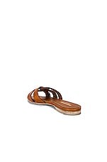 Saint Laurent Tribute Flat Sandal in Amber, view 3, click to view large image.