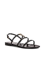 Saint Laurent Cassandra Leather Flat Sandals in Nero, view 3, click to view large image.