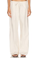 Toteme Cotton Drawstring Trousers in Stone, view 1, click to view large image.