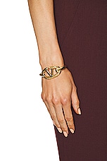 Valentino Garavani V Logo Moon Bangle Bracelet in Oro, view 2, click to view large image.
