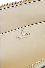 Valentino Garavani East West Rockstud Duffle Bag in Ivory, view 7, click to view large image.