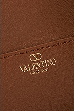 Valentino Garavani Medium V Logo Drawstring Bag in Black, view 6, click to view large image.