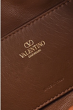 Valentino Garavani Medium V Logo Drawstring Bag in Tobacco, view 6, click to view large image.