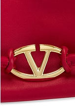 Valentino Garavani Medium V Logo Drawstring Bag in Rosso, view 8, click to view large image.