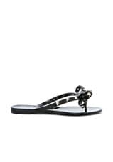 Valentino Garavani Summer Rockstud PVC Bow Thong Sandal in Black, view 1, click to view large image.