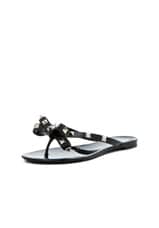 Valentino Garavani Summer Rockstud PVC Bow Thong Sandal in Black, view 2, click to view large image.