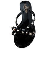 Valentino Garavani Summer Rockstud PVC Bow Thong Sandal in Black, view 4, click to view large image.