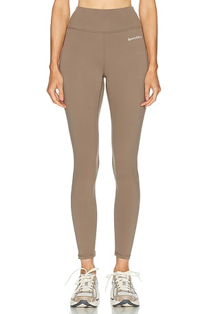 Sporty & Rich Serif Logo Legging in Tan
